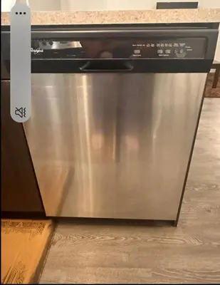 a stainless steel dishwasher sitting in a kitchen at Entertainment house with 2 king 1 queen 1 sofa bed In-house Theater Attach Garage Near YEG Loved by Guests on Other Plateform in Edmonton