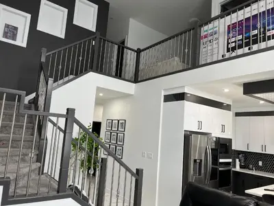 a kitchen and staircase in a house at Private room with full washroom in Edmonton