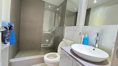 a bathroom with a sink and a toilet and a shower at Ocean and Mountain View Home - Downtown Vancouver in Vancouver