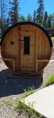 a small wooden boat sitting on the ground at Luxury 1BR at Red Mountain Ski-Bike Sauna in Rossland