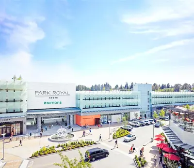an overhead view of a shopping mall with cars parked in front at 2BD cozy guest suite in West Vancouver! in West Vancouver