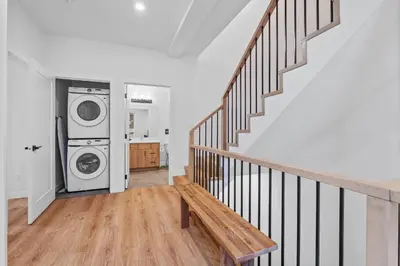 a laundry room with a washer and dryer at Luxurious Large 3 Bedroom Loft Saskatchewan Drive in Edmonton