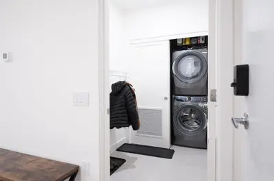 a laundry room with a washer and dryer at Bluebird by Revelstoke Vacations in Revelstoke