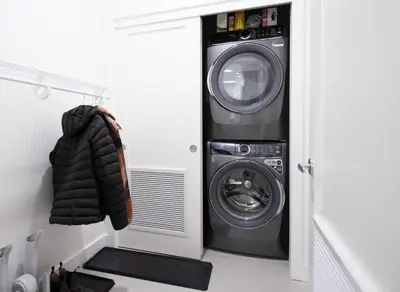 a washer and dryer in a laundry room at Bluebird by Revelstoke Vacations in Revelstoke