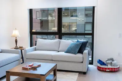 a living room with two couches and a coffee table at Bluebird by Revelstoke Vacations in Revelstoke