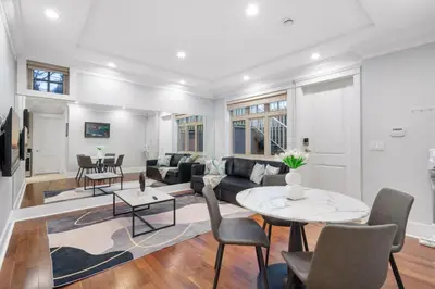a living room with a couch and a table at NEW Private 1BR Near Kerrisdale and UBC w Laundry in Vancouver