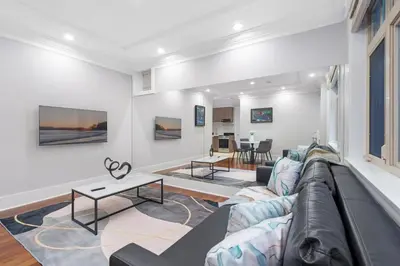 a living room with a couch and a table at NEW Private 1BR Near Kerrisdale and UBC w Laundry in Vancouver