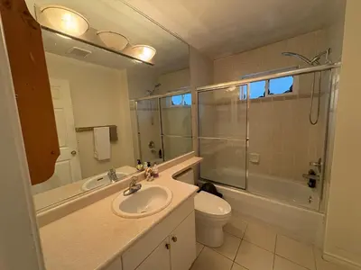 a bathroom with a sink and a shower and a toilet at Vancouver Budget Stay- Free Parking, Fast WiFi, Near Airport & Downtown 15 Min in Vancouver