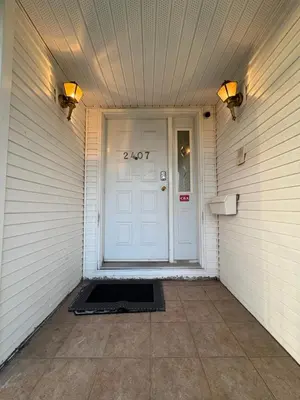 a front door of a house with a number on it at Vancouver Budget Stay- Free Parking, Fast WiFi, Near Airport & Downtown 15 Min in Vancouver