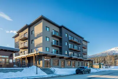 a building with a car parked in front of it at Modern 2BR in Golden w/ Stunning MTN Views! in Golden