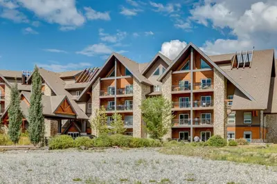 an exterior view of an apartment building at Renovated Haven in Rockies with Hot Tub and Pool in Canmore