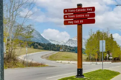a street sign on the side of a road at Cozy Rocky Mountain Studio with Hot tub and Gym in Canmore
