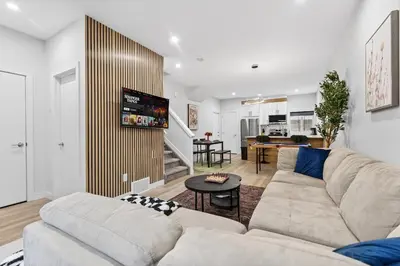 a living room with a couch and a table at Honeyville House Sleeps 8 Pool Table in Edmonton