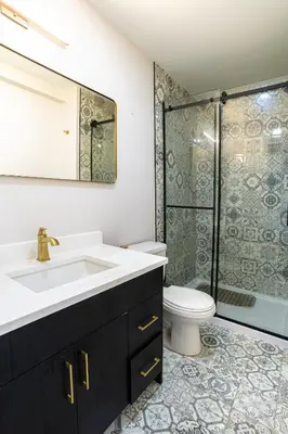 a bathroom with a sink and a toilet and a shower at Edmonton Home in Edmonton