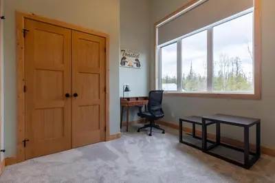 an office with a door and a desk and a chair at Moose Lodge by Fernie Central Reservations in Fernie