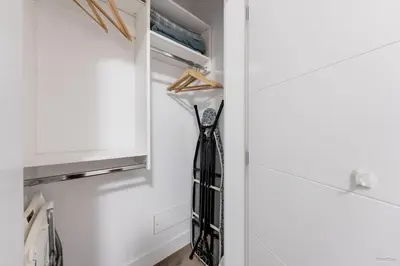 a black tie hanging in a refrigerator door at Private Entrance Suite Near Deer Lake & Metro in Burnaby