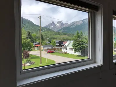 a window with a view of a mountain at Huckleberry Lodge by Fernie Central Reservations in Fernie