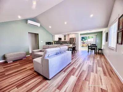 a living room with a couch and a table at Harbourview Hideaway Sooke in Sooke