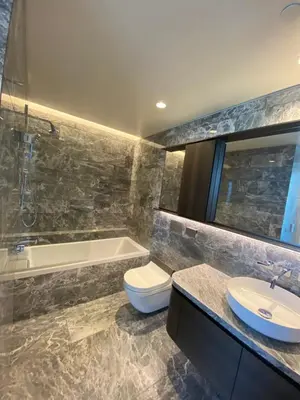 a bathroom with a tub and a toilet and a sink at Modern Brand New 1-Bedroom Condo in Downtown in Vancouver