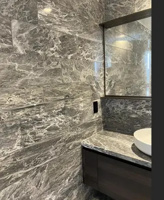 a bathroom with a sink and a mirror at Modern Brand New 1-Bedroom Condo in Downtown in Vancouver