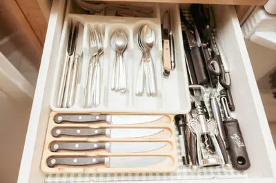 a drawer filled with utensils and utensils at Cozy 2BR-5BD Suite - Mountain Views - Htd Parking in Canmore