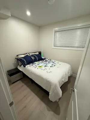a bedroom with a bed and a window at ideal place in Prince George