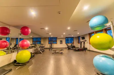 a gym with exercise equipment and balloons on the walls at Alpine Chic - two-story mtn escape near downtown in Canmore