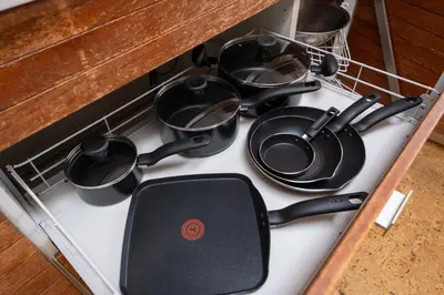a stove top with a bunch of pots and pans at Elegant Cypress Park Villa with Panoramic Ocean View in West Vancouver