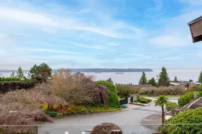 a view of the water from a house at Elegant Cypress Park Villa with Panoramic Ocean View in West Vancouver