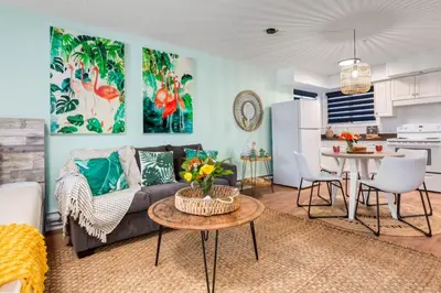 a living room with a couch and a table at Cozy Tropical Vibe Haven in Canmore near Banff in Canmore