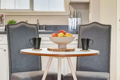 a bowl of fruit on a table in a kitchen at Cozy Condo in the Heart of Canmore in Canmore