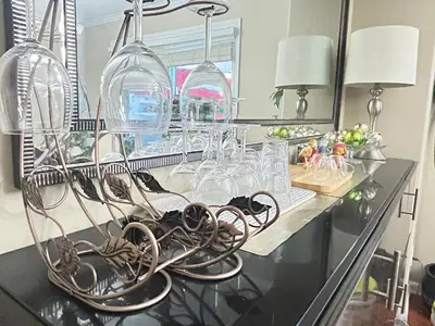 a counter with wine glasses and wine racks at Luxury & Spacious three bedrooms House Near Coquitlam Town Centre in Coquitlam