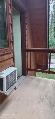 a porch with a air conditioner sitting on a patio at Brown Family Farm in Grand Forks