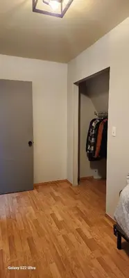an empty room with a closet and a door at Brown Family Farm in Grand Forks