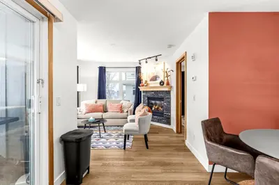 a living room with a couch and a fireplace at Mesmerizing 2BR Retreat Made For You in Canmore