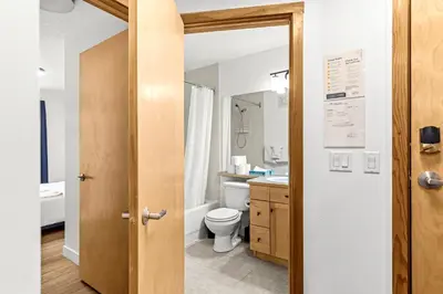 a bathroom with a toilet and a sink at Mesmerizing 2BR Retreat Made For You in Canmore