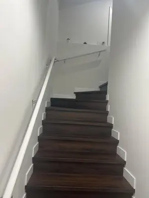 a stairway with a bunch of books on it at Kizito in Edmonton