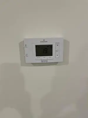 a digital clock on a wall on a wall at cozy basement suite with 1-bed, wi-fi & Neflix in Edmonton