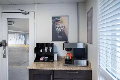 a kitchen with a counter with a coffee maker at Motel 6-Fort St. John, BC in Fort Saint John