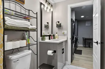 a bathroom with a sink and a toilet at Guest Suite in Edmonton, King bed and parking in Edmonton