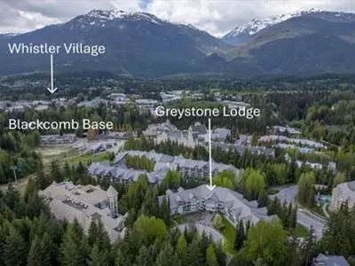an aerial view of a city with mountains and trees at 1BR | Greystone Lodge | Ski in / Ski out | Pool & Hot Tub | Epic Locations in Whistler