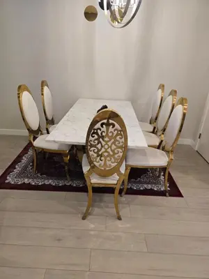a dining room with a table and chairs at Cozy Comfort Homestaed-Near Airport in Calgary