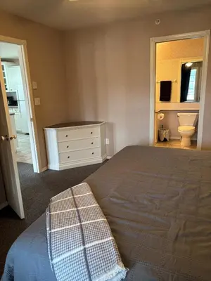 a bedroom with a bed and a sink and a toilet at Cozy getaway with a view! in Fairmont Hot Springs