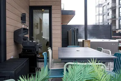 a table and chairs sitting on a patio at Revel and Rest by Revelstoke Vacations in Revelstoke