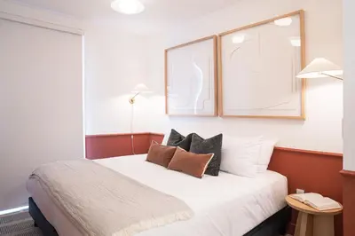 a bedroom with a bed with pillows on it at Revel and Rest by Revelstoke Vacations in Revelstoke