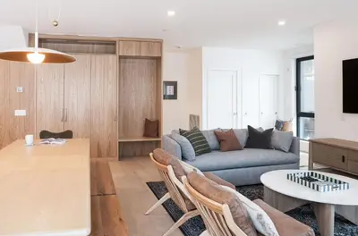 a living room with a couch and a table at Revel and Rest by Revelstoke Vacations in Revelstoke