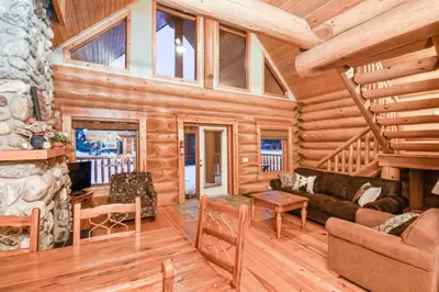 a log cabin with a living room and a fireplace at Authentic, Timber Log Cabin Perfect for Groups in Golden