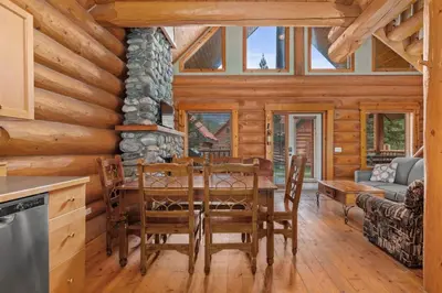 a dining room with a table and chairs in a cabin at Rustic Chalet Perfect Getaway for Groups in Golden