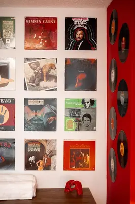 a wall with many movies and posters on it at Retro-Chic Hideaway - Walking Distance To Stampede in Calgary