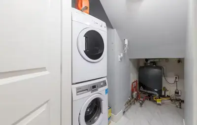 a white washer and dryer in a room at Large 3 Bedroom Laneway House in Vancouver